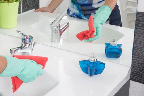 Cleaning operative wearing PPE during carpet cleaning work